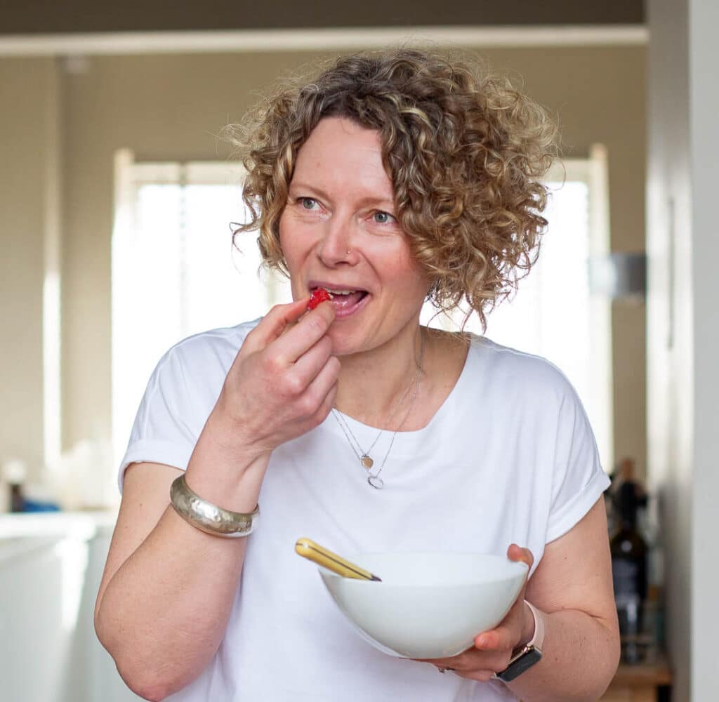 Weight loss coach Kate Houldsworth eating a raspberry